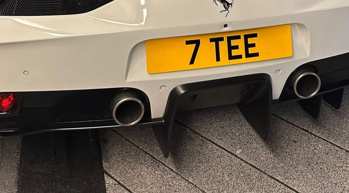 Rear plate fitted to a white Ferrari
